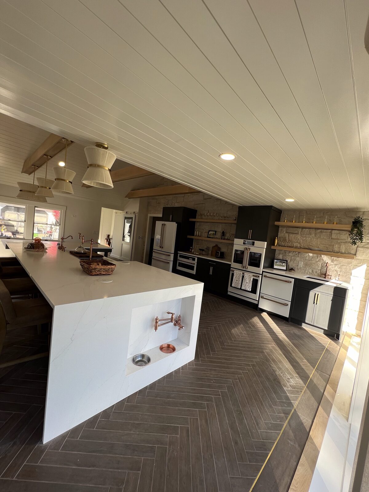 Custom kitchen with marble waterfall island