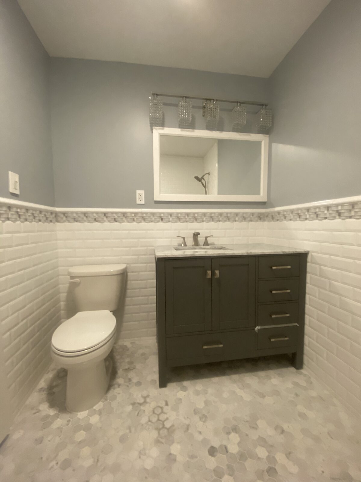 Bathroom with custom vanity and tile