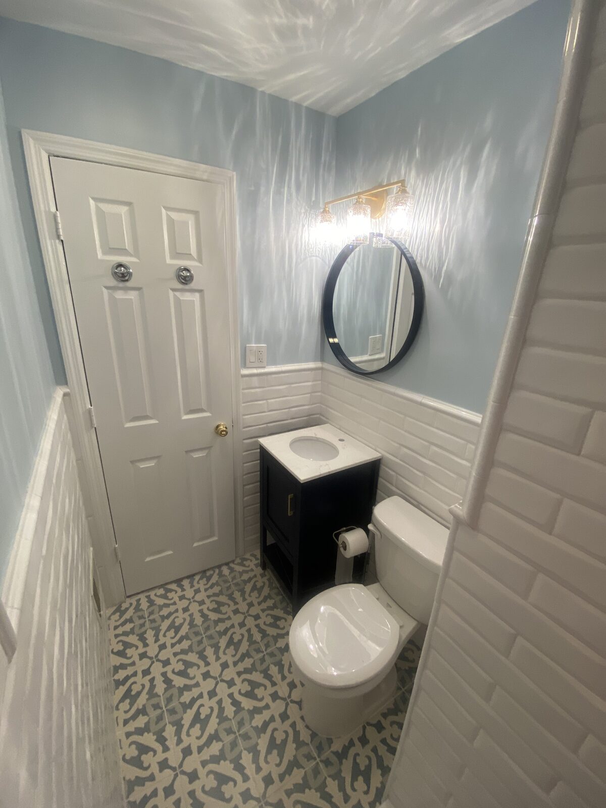 Bathroom remodel with patterned tile floor