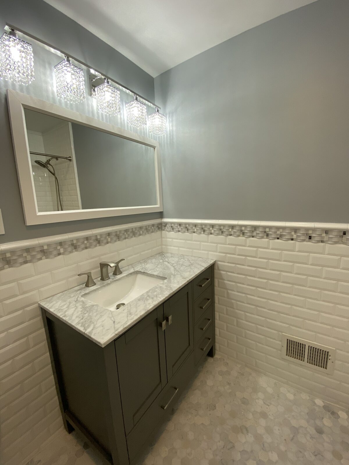 Bathroom vanity and lighted mirror